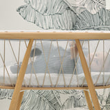 Seitenansicht von Baby in Babywiege KUMI von Charlie Crane mit Schnüren in beige