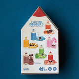 Londji Puzzle My Colours – Rückseite der Verpackung mit den sieben Wendepuzzles